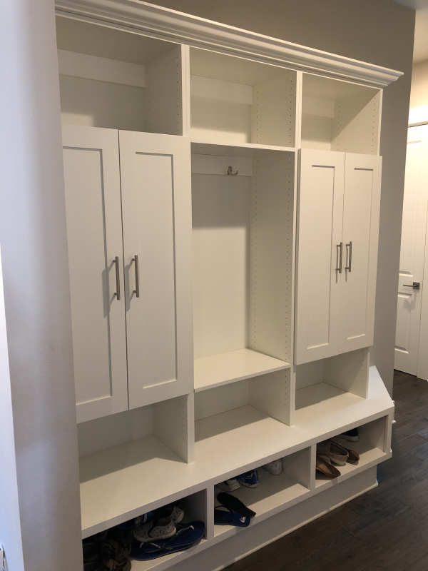 Image if a mudroom with shoe storage and cabinets.