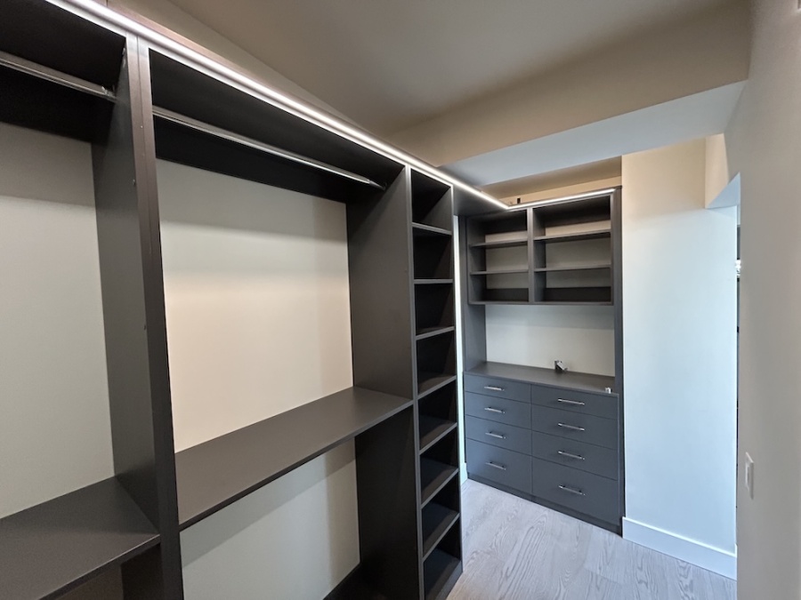 Custom walk-in closet by Northwest Closets and Wallbed